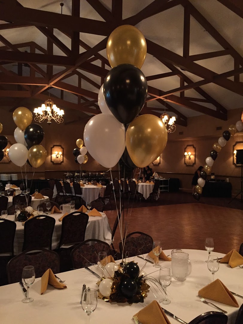 Party Balloons And Centerpieces At The Barnyard Carriage